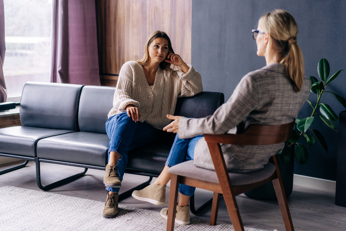 Woman Talking to a Female Psychotherapist Indoors